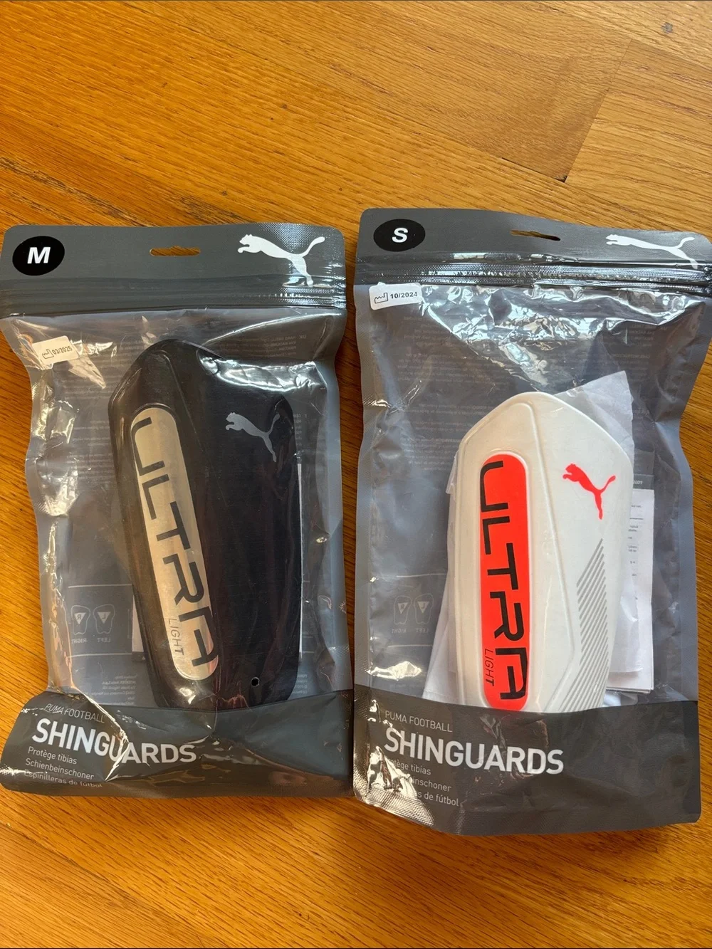 2 Pair for $35. Puma Black and White Shin Guards. NWT